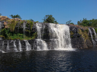 Beautiful and tall waterfall sliding down the rock wall in Serra do Cipó in Minas Gerais, Brazil