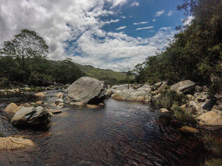 Beautiful and tall waterfall sliding down the rock wall in Serra do Cipó in Minas Gerais, Brazil