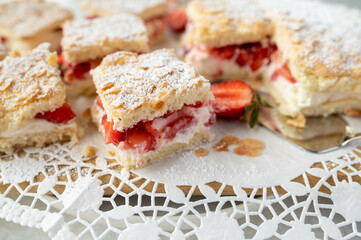 Strawberry sponge cake with delicious cream filling and almond topping
