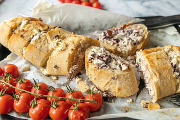 Stuffed Baguette with feta cheese, herbs and kalamata olives