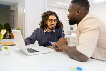 Professional office discussion between two men