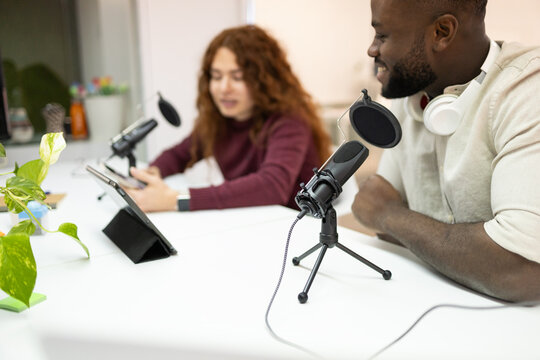 Podcast recording session with diverse hosts