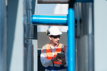 Engineers inspect the completed air conditioning and water systems to continue verifying their...
