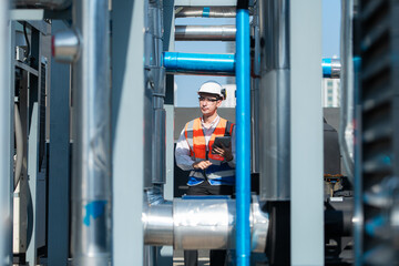 Engineers inspect the completed air conditioning and water systems to continue verifying their...