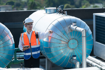 Engineers inspect the completed air conditioning and water systems to continue verifying their...