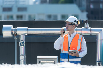 Engineers inspect the completed air conditioning and water systems to continue verifying their...