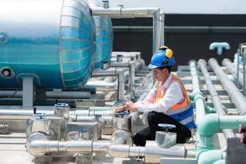 Engineers inspect the completed air conditioning and water systems to continue verifying their...