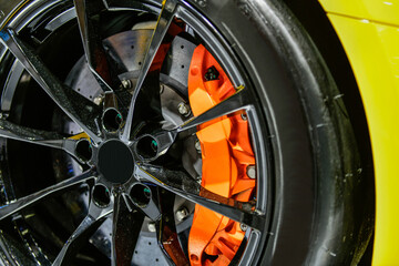 Close up Car alloy wheel and disc-brake sport car
