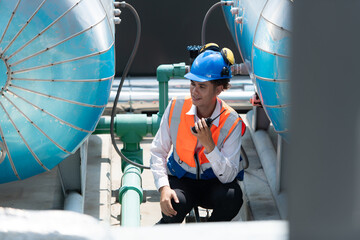 Engineers inspect the completed air conditioning and water systems to continue verifying their...