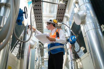 Engineers inspect the completed air conditioning and water systems to continue verifying their...