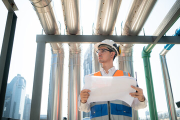 Engineers inspect the completed air conditioning and water systems to continue verifying their...