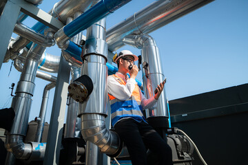 Engineers inspect the completed air conditioning and water systems to continue verifying their...