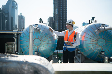 Engineers inspect the completed air conditioning and water systems to continue verifying their...