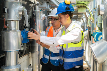 Engineers and technicians Inspect the completed air conditioning and water systems to continue...