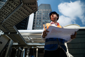 Engineers inspect the completed air conditioning and water systems to continue verifying their...