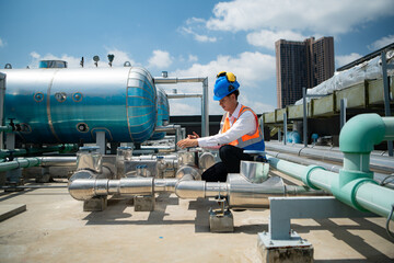 Engineers inspect the completed air conditioning and water systems to continue verifying their...