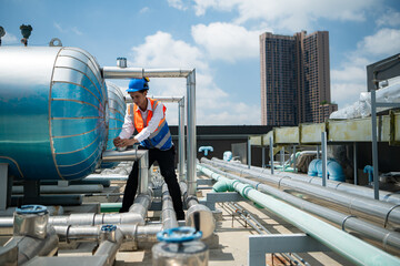 Engineers inspect the completed air conditioning and water systems to continue verifying their...