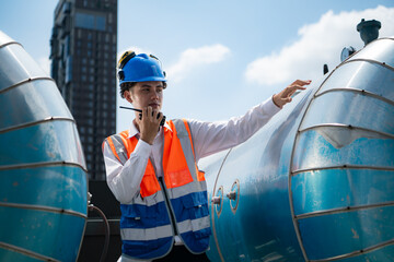 Engineers inspect the completed air conditioning and water systems to continue verifying their...