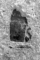 old tombstone in cemetery with a blank epithet and room for text in a black and white film negative