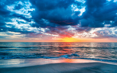 Vibrant sunset over the serene ocean. Naples Beach, Florida