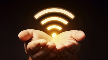 A hand holding a wifi inter net icon symbol on dark background.