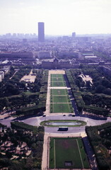 View from the top level of the Eiffel Tower, down the Champ de Mars, with the Tour Montparnasse (Montparnasse Tower) in the distance during 1990s