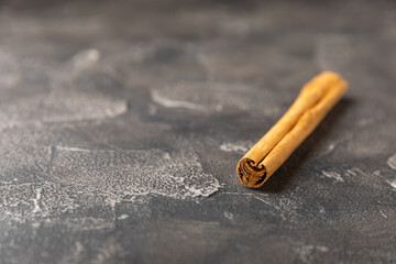 Ceylon cinnamon.Cinnamon sticks on a textured wooden background. Cinnamon roll and powder. Spicy spice for baking, desserts and drinks. Fragrant ground cinnamon. Close-up. Place for text. copy space