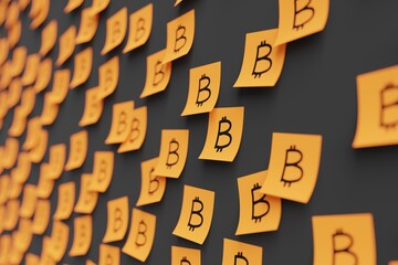 Many orange stickers on black board background with bitcoin symbol drawn on them. Closeup view with...