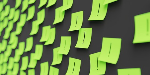 Many green stickers on black board background with exclamation mark symbol drawn on them. Closeup...