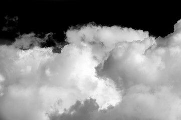 White cloud on a black background. Sharp contrast between the white cloud and the black background....