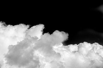 White cloud on a black background. Sharp contrast between the white cloud and the black background....