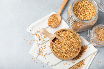 Green buckwheatin  on a wooden kitchen table.Superfood.Raw buckwheat porridge.Healthy vegan food concept, eco products, diet. Copy space.Organic food.weight loss and proper nutrition.