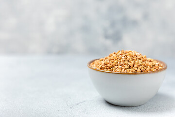 Green buckwheatin  on a wooden kitchen table.Superfood.Raw buckwheat porridge.Healthy vegan food...