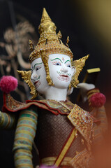 The marionette of Brahma in ancient Thai costume and art design.This kind of performance in...