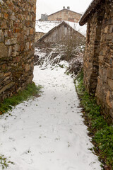 snowy stone streets and buildings in a picturesque town in the Spanish province of León, called Colinas del Campo
