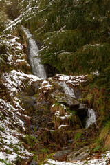 waterfall in the forest of a picturesque snowy town in the Spanish province of León, called Colinas del Campo