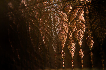 Very close up shot of Elegance and luxuarius Thai silk weaving along with golden thread. Shooting...