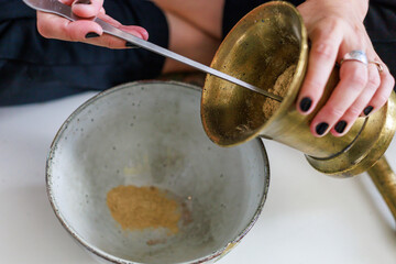 Manual process of making incense cones.