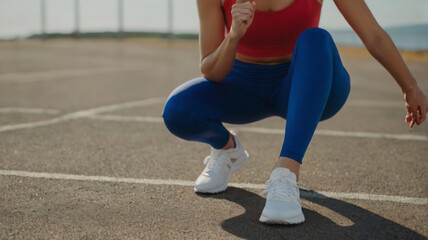 woman in sportswear doing sports kicks - 774072716