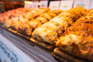 freshly baked empanadas with different fillings for sale