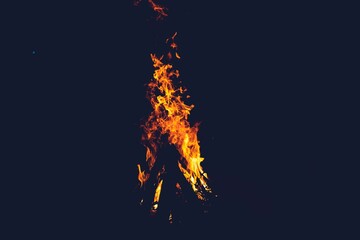 Closeup of a bonfire in a forest at night