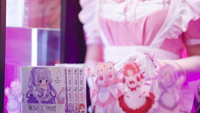 Headless pink maid cosplayer offering cute anime maid figure on art stand 4K