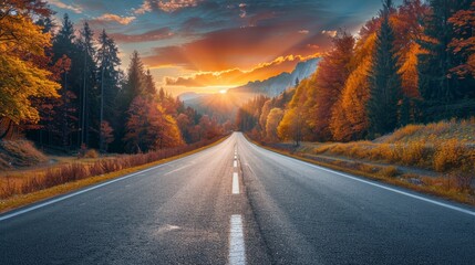 Black asphalt road landscape at sunset in beautiful colorful nature. Highway scenery among...