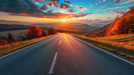 Black asphalt road landscape at sunset in beautiful colorful nature. Highway scenery among...