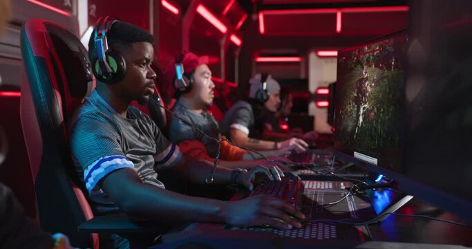 Professional esports gamers celebrating a win at a gaming tournament