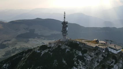 Afwasbaar behang Dolomieten Transmission tower in the mountain peaks of the Dolomites in Italy