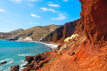 Red beach in Santorini island, Greece. Red volcanic cliffs and the blue sea.