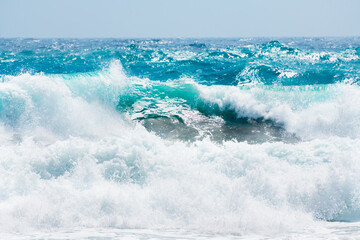 Blue sea and the blue sky. Waves on the beach. Mediterranean sea