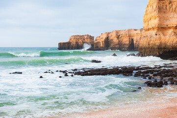 Rocks on the shore of Atlantic ocean in Algarve, Portugal.