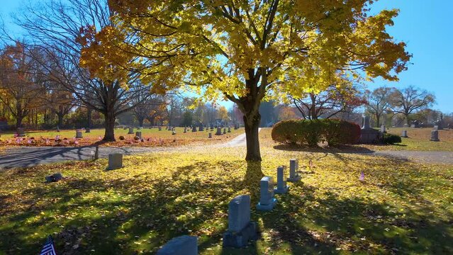 Daytime view of a cemetery during colorful fall in Enfield, Connecticut